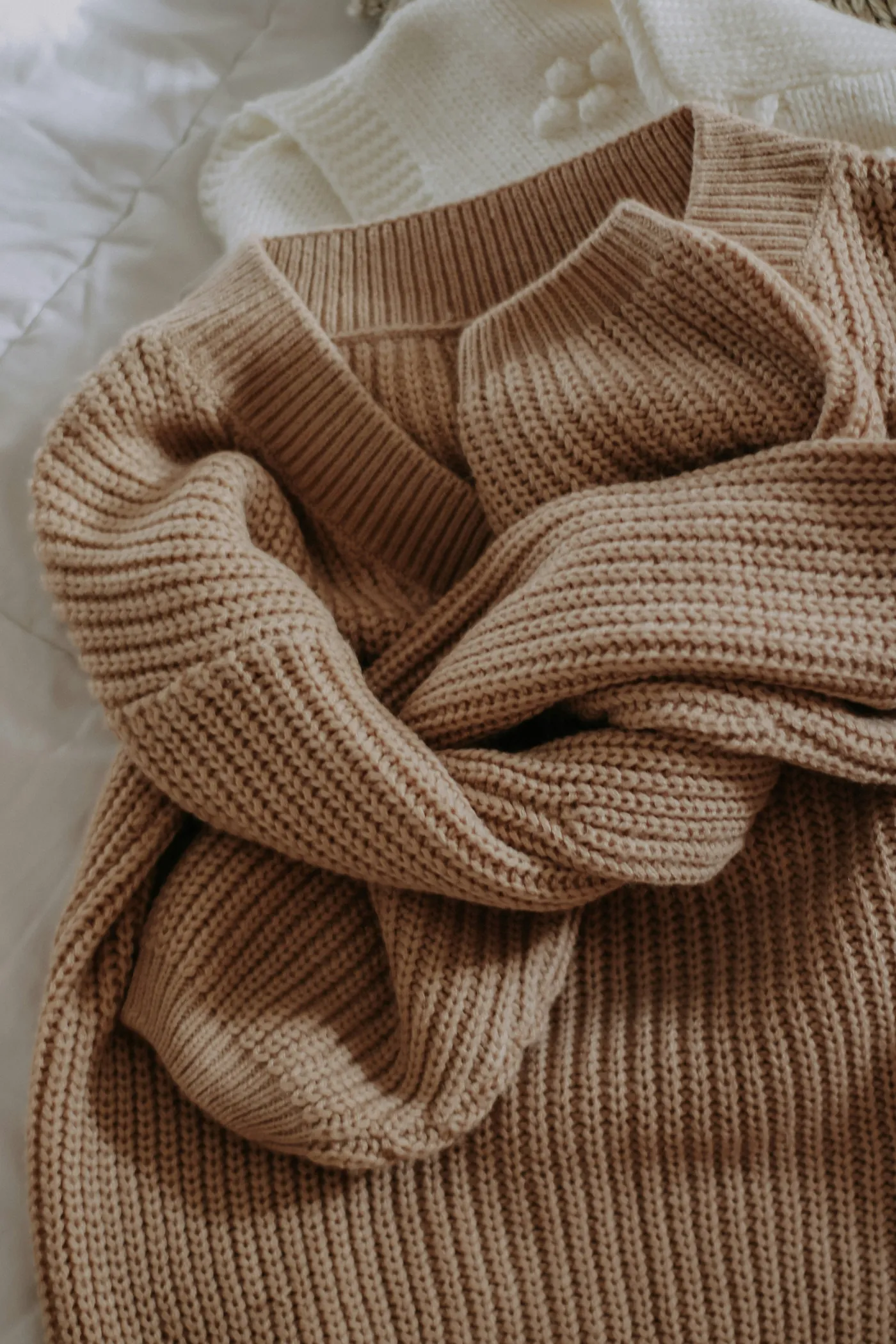 A folded beige knit garment